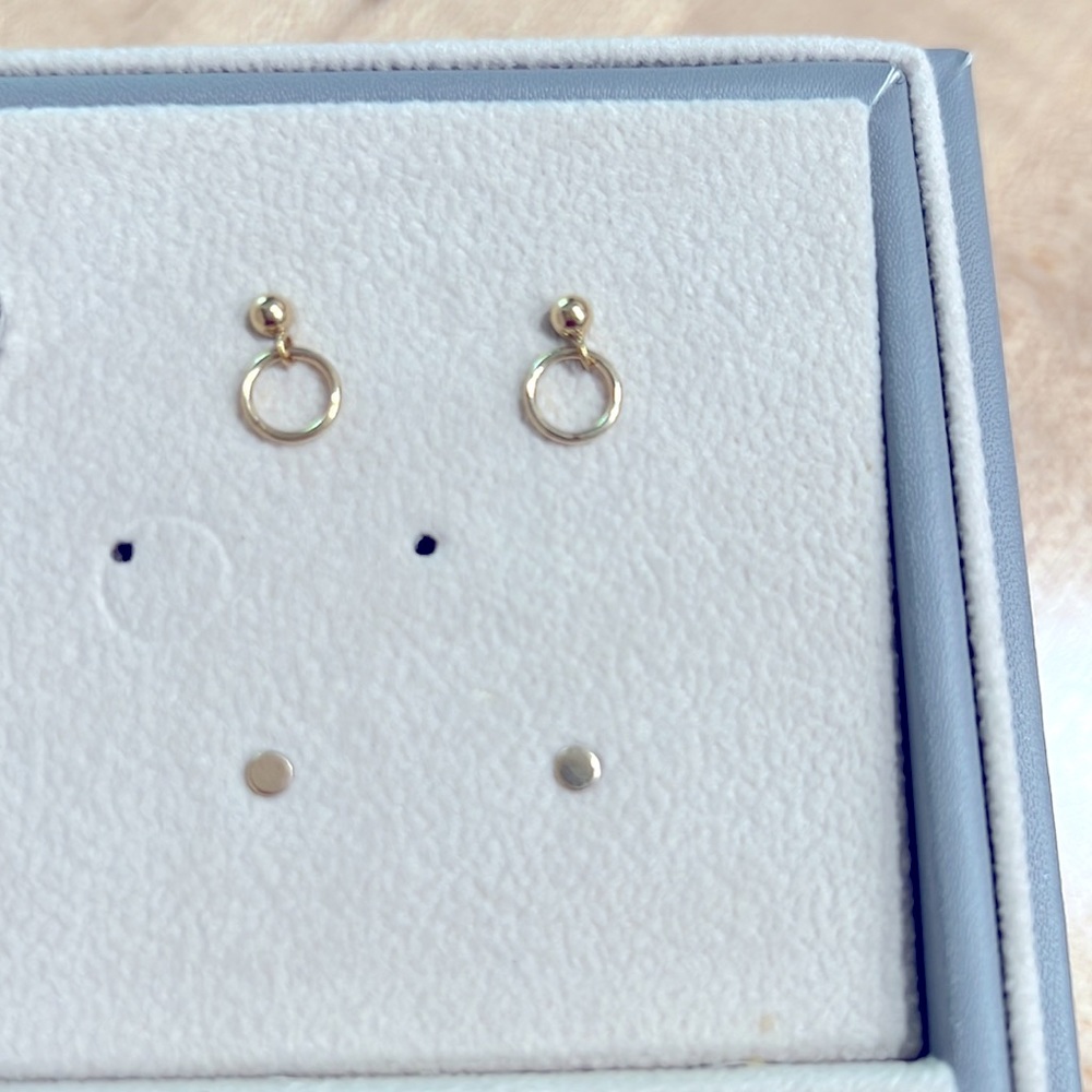 Two sets of earring studs.